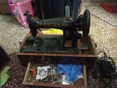 SALIKA sewing machine for sale with electric motor & wooden box frame.