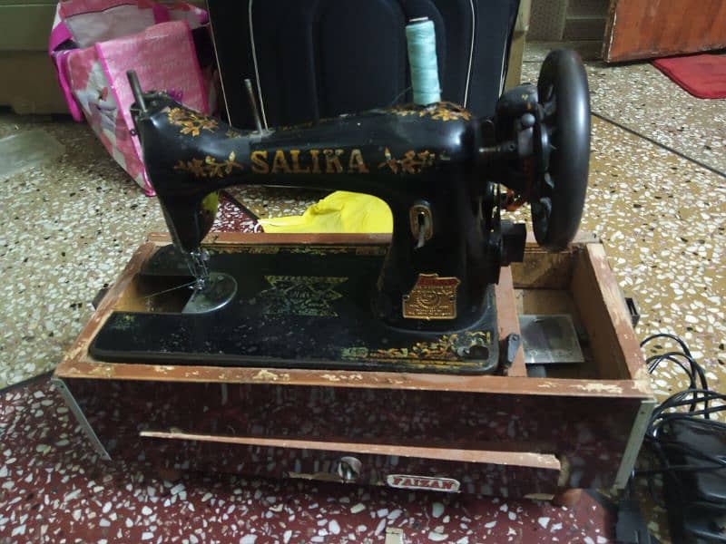 SALIKA sewing machine for sale with electric motor & wooden box frame. 1