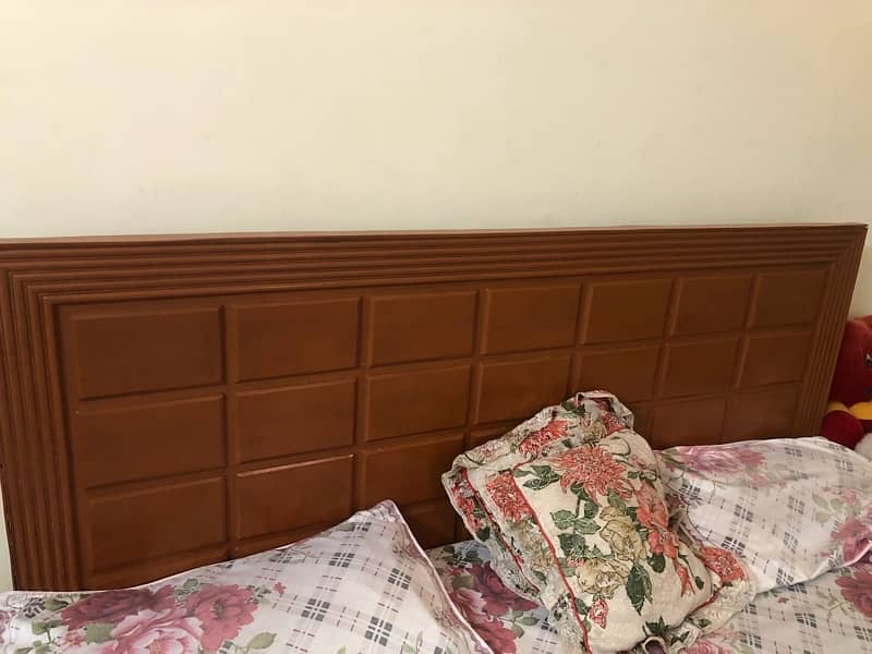 wooden bed with mattress 0