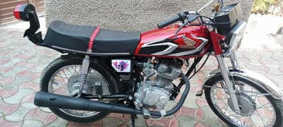 Honda 125 with Golden Number