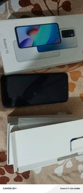 REDMI 10 6+128 GB WITH BOX IN ORANGE CHARGER 1