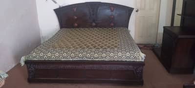 king side bed with dressing table and side tables