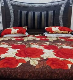 solid king size bed with side tables and dressing