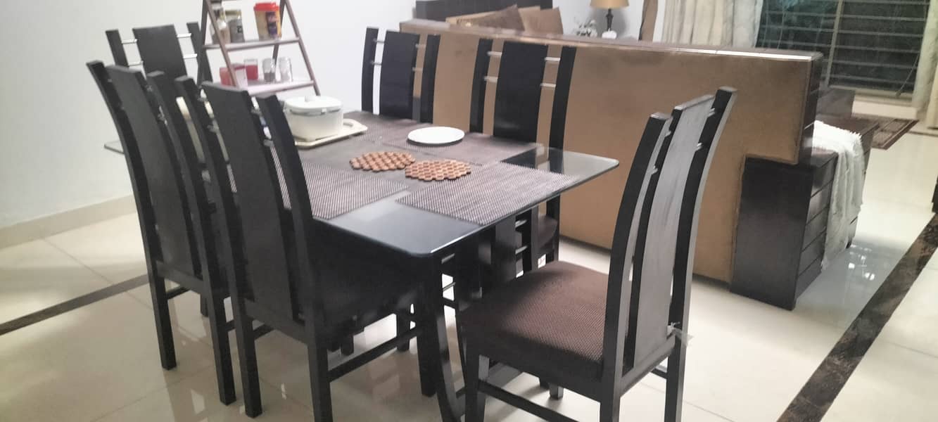 Gently used dining table with glass top and six chairs. (FOR SALAE!) 1