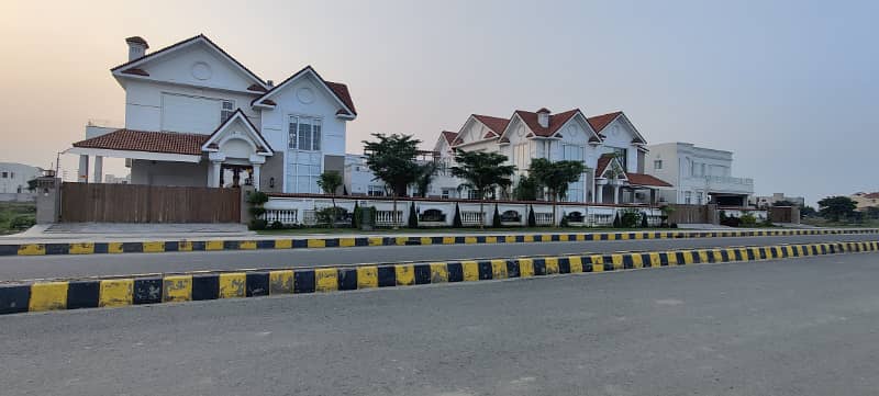 one kanal possession plot surrounded by houses T block ph7 2