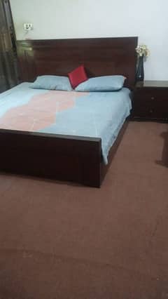 double bed with side tables and dressing