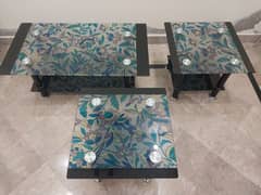 Artistic colourful glass tables enhance your home's look.