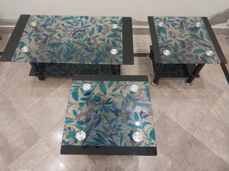 Artistic colourful glass tables enhance your home's look. 1