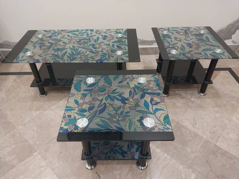 Artistic colourful glass tables enhance your home's look. 2