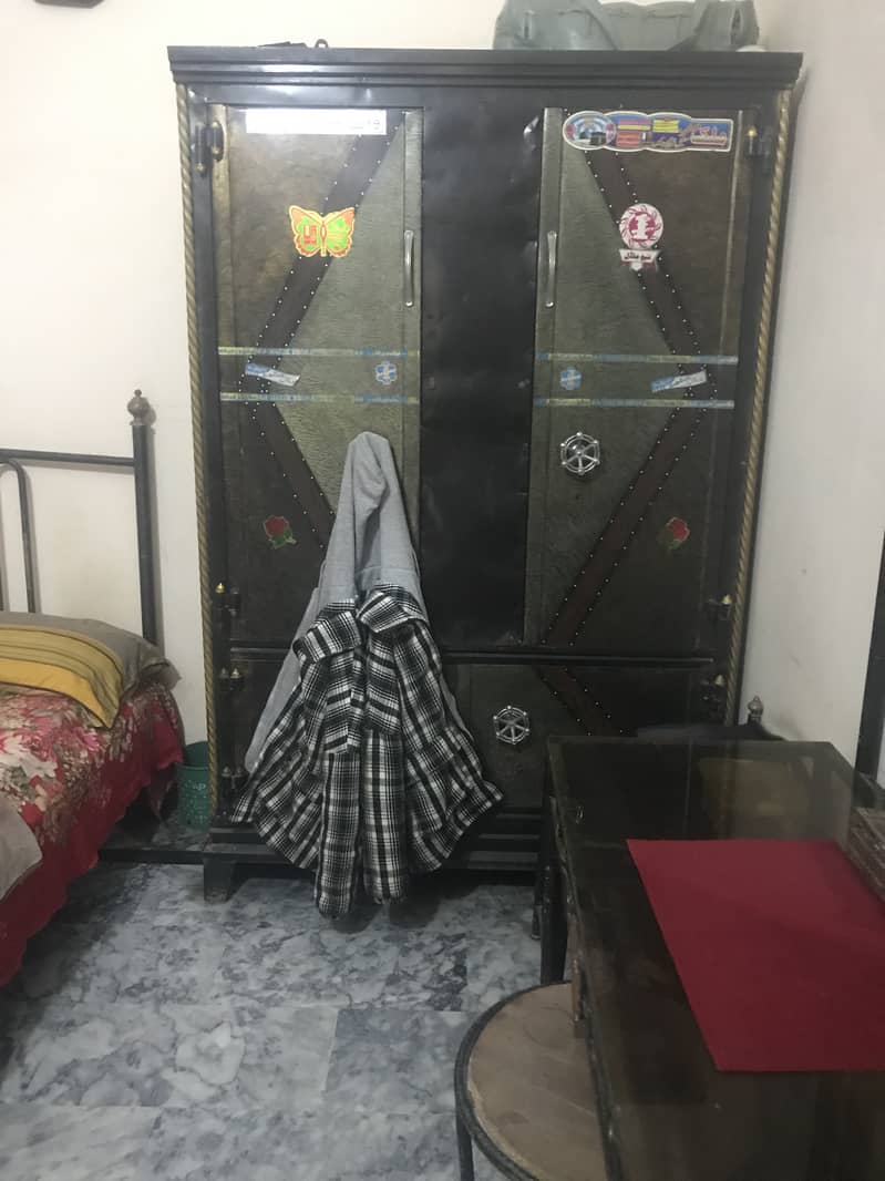 Bed and showcase ,steel cupboard and iron standing 1