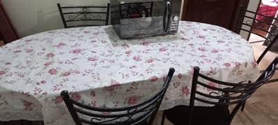 Glass Dining Table with six chairs. (used) 8/10 condition.