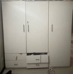 white 3 door purpose built cupboard