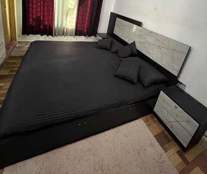 king size bed with 2 side tables and dressing table 1