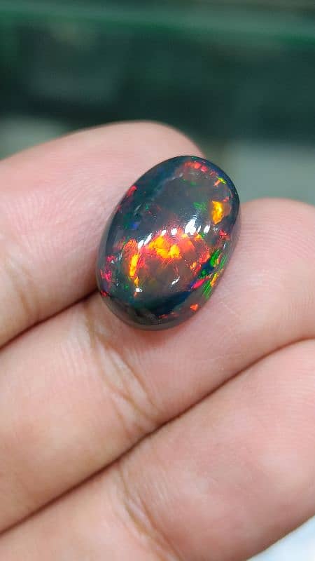 Galaxy Black Opal full fire multi color natural big size opal for sale 1