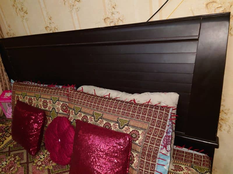 dark brown colour king size bed. 0