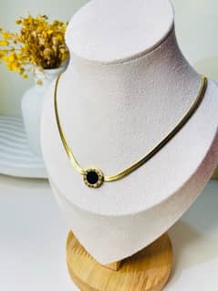 Gold black circle pendant