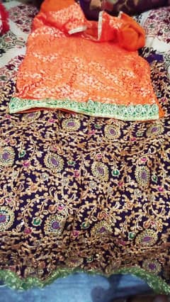 purple lehnga with orange shirt and purple dupatta