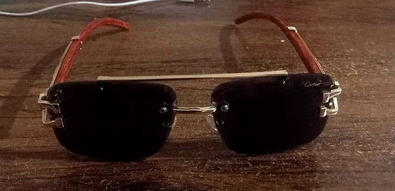 Sunglasses with golden & wooden color frame & black glass 0