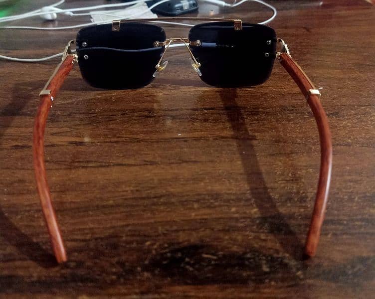 Sunglasses with golden & wooden color frame & black glass 2