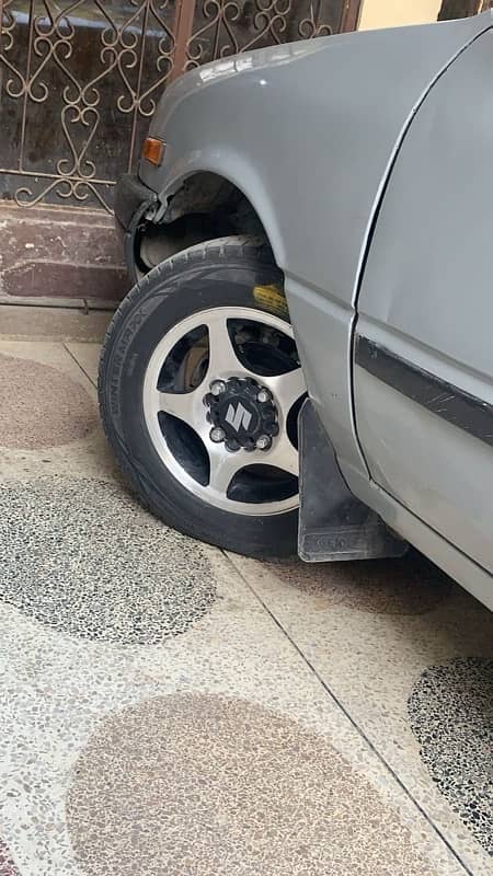 alloy rims with tire for urgent sale 1