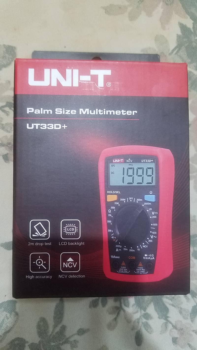 Unit-T UT33+ Series Palm Size Multimeters.  O3244833221 1