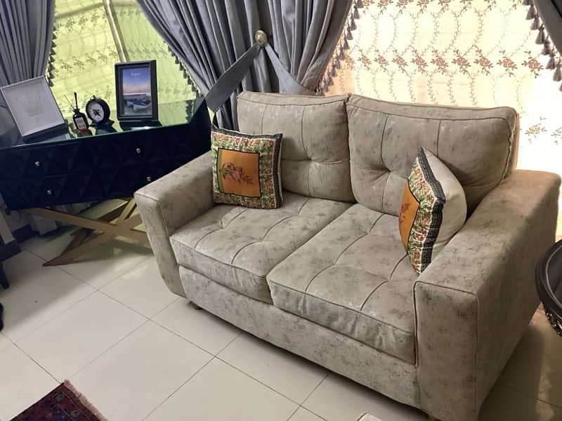 sofa  seater beige colored  fabric 1