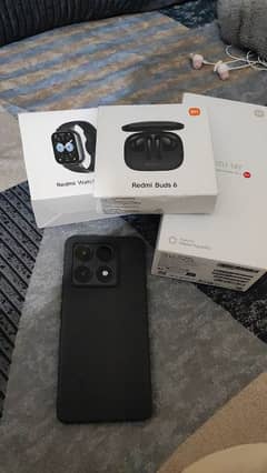 Xiaomi 14t with redmi 5 earbuds and redmi 5 lite watch