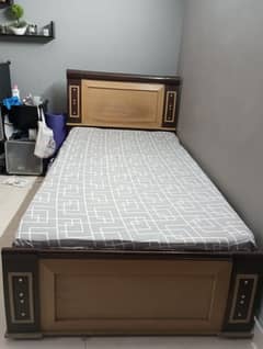 Twin wood bed with side table and dressing