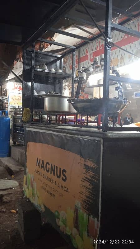 food stall, counter for chips, limca soup, french fries. 8