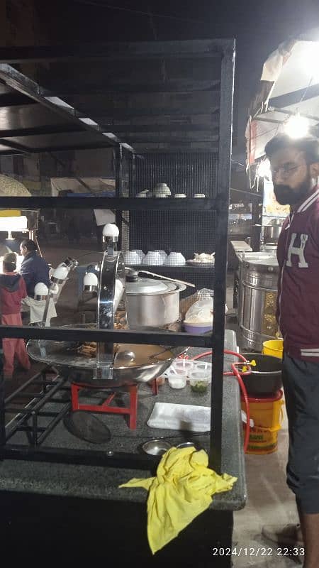 food stall, counter for chips, limca soup, french fries. 9