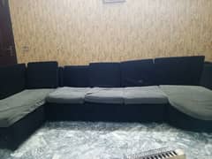 l shape sofa in black colour