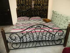 Iron wooden bed along with mattress