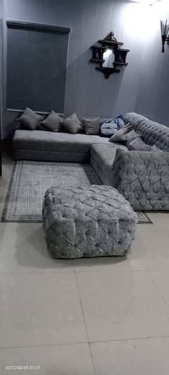 L shaped  grey color sofa