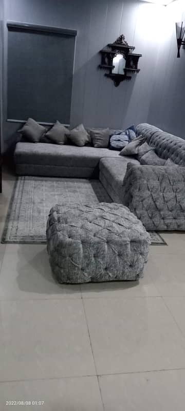 L shaped  grey color sofa 0