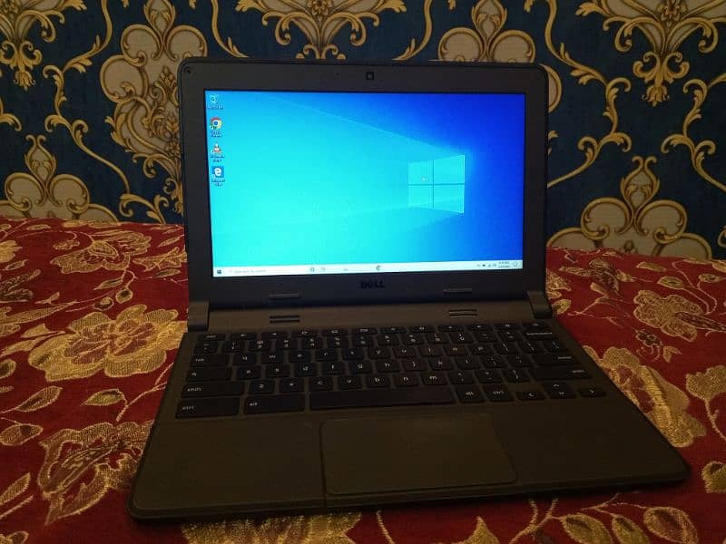 black laptop with charger used good culality dell company 2gb ram 5