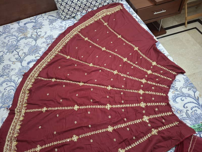 Unstitched hand embelished bridal lehnga 4