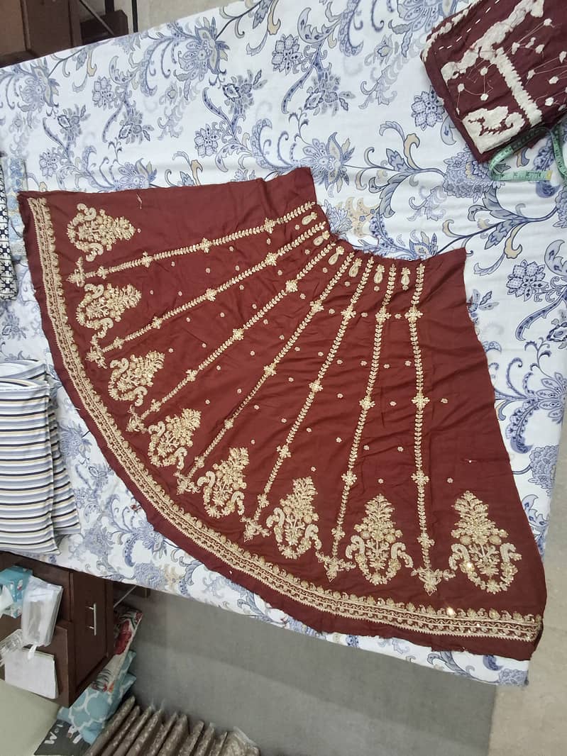 Unstitched hand embelished bridal lehnga 6