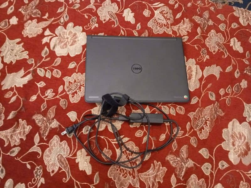 black laptop with charger used good culality dell company 2gb ram 7