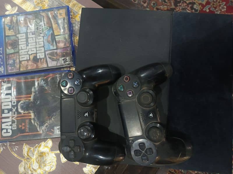 PlayStation 4 with 2 controllers original 12