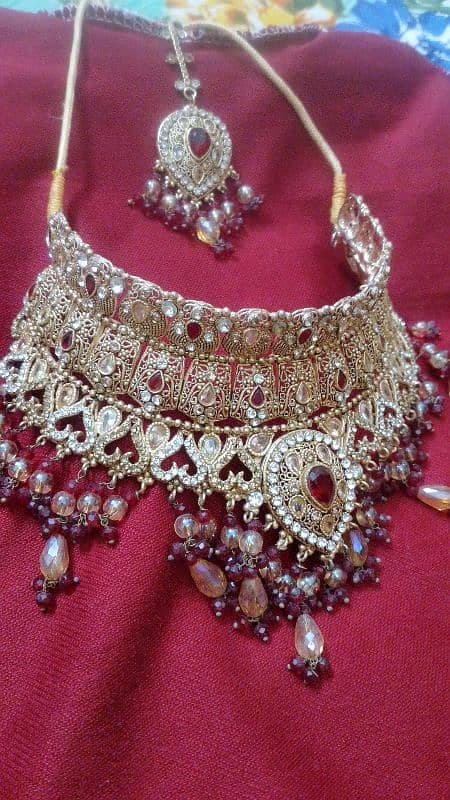 jewelry set golden color mehroon perls 1 time used 10