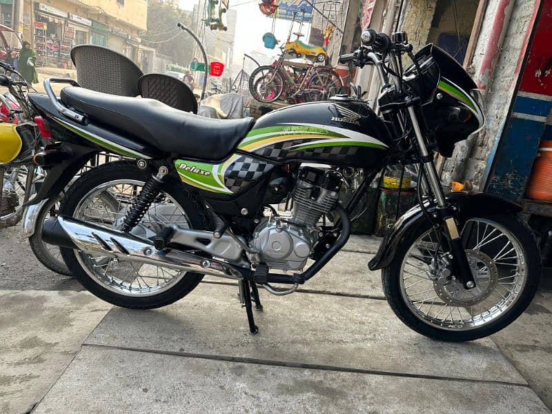 Honda deluxe. mobile number 0340 5443364. 8