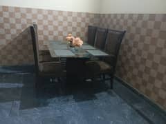 6 solid wood chairs and top glass dining table condition used good