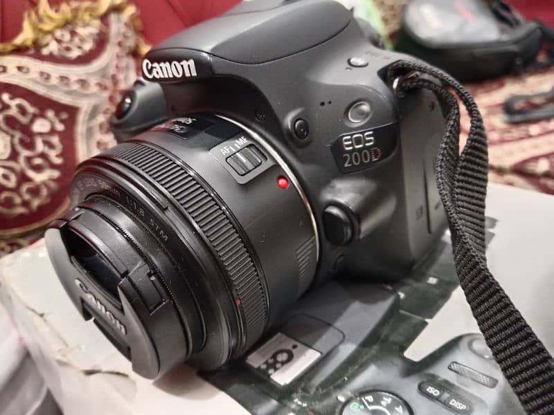 canon 200d kit (18-55mm) lens and 50mm lens with tripod 3