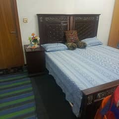 used double bed with side table