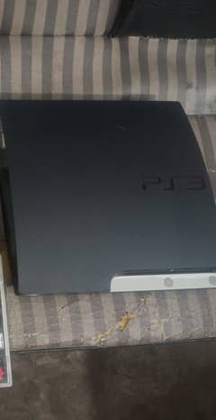 PlayStation 3 slim with one controller and a games