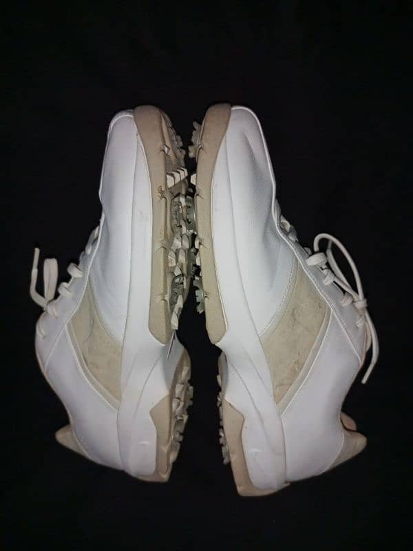 Nike sport performance spiked white shoes 1