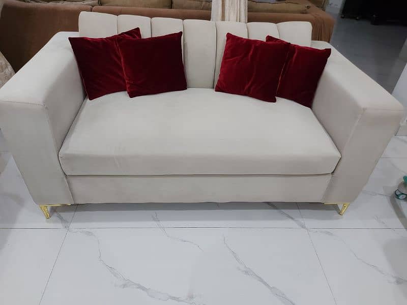 Designer 2 seater sofa with brass finished feet 0