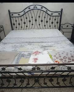 bed with side table and dressing table