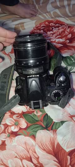 Nikon digital camera and charger  18.55 mm 1:3.5-5.6 camera