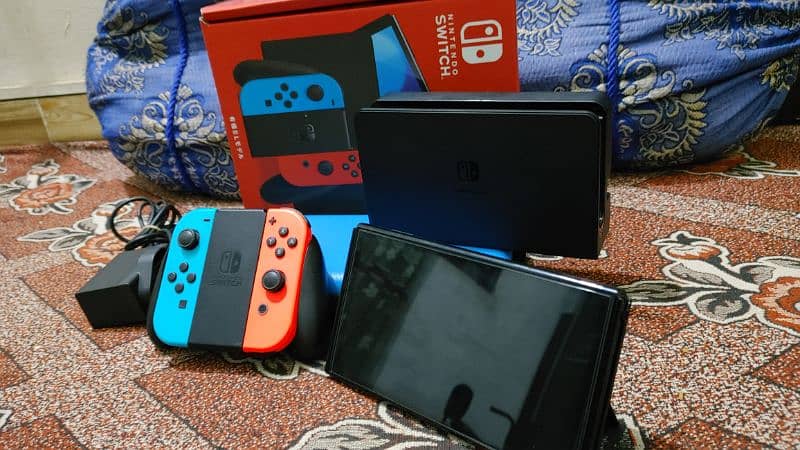 Nintendo switch oled jailbreak 128gb with boxe complte 1